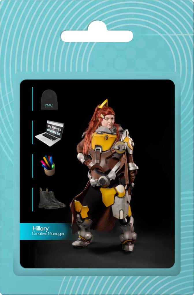 Creative character representation of Hillary, PMC's Creative Manager, in a dynamic pose, featuring a vibrant costume with yellow and brown elements, surrounded by creative tools like a laptop and colorful markers, emphasizing the innovative culture at PMC Media Group.