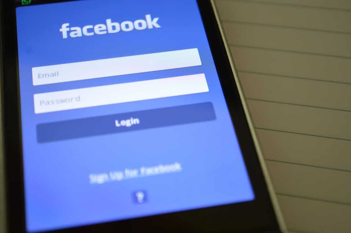 Facebook login screen displayed on a smartphone, featuring fields for email and password, relevant to social media advertising and brand engagement strategies.