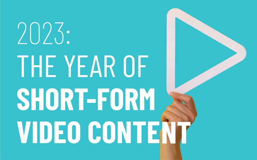 2023: The year of short-form video content with a hand holding a play button symbol on a turquoise background, emphasizing digital marketing trends.