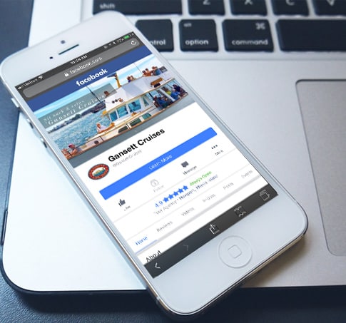 Smartphone displaying Facebook page for Gansett Cruises, emphasizing digital marketing and social media engagement in the advertising industry.