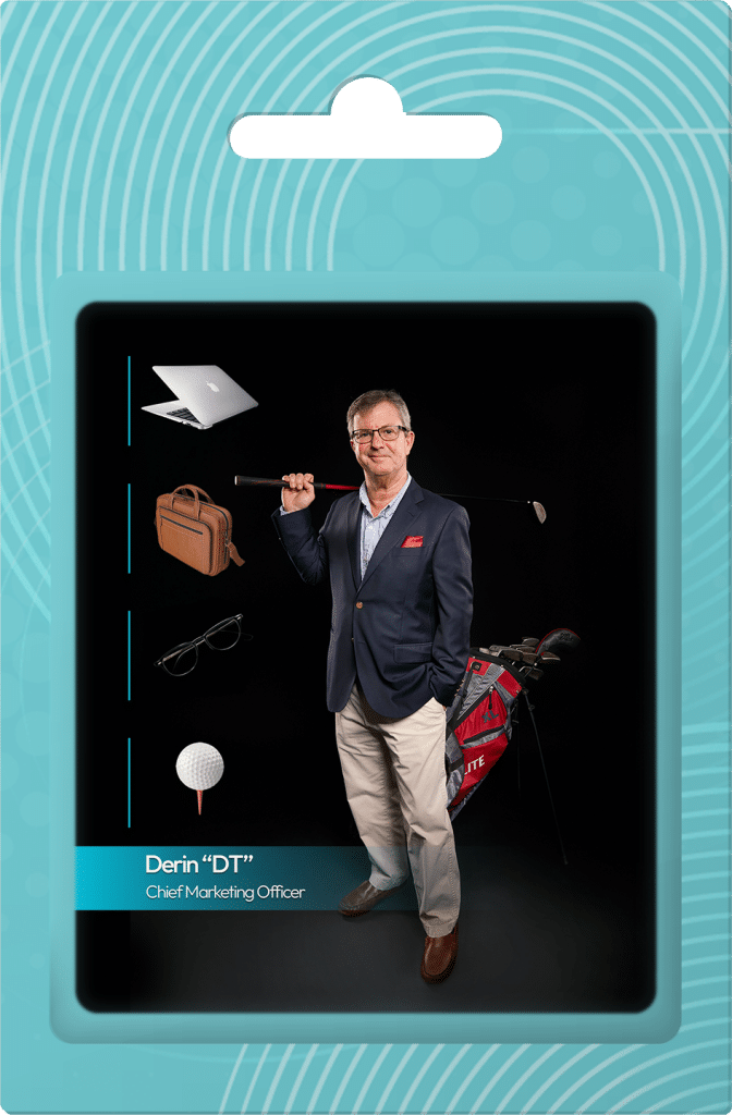 Derin Temel, Chief Marketing Officer at PMC Media Group, standing confidently with a golf club, surrounded by a laptop, briefcase, glasses, and golf equipment, reflecting his dual focus on strategic marketing and personal interests.
