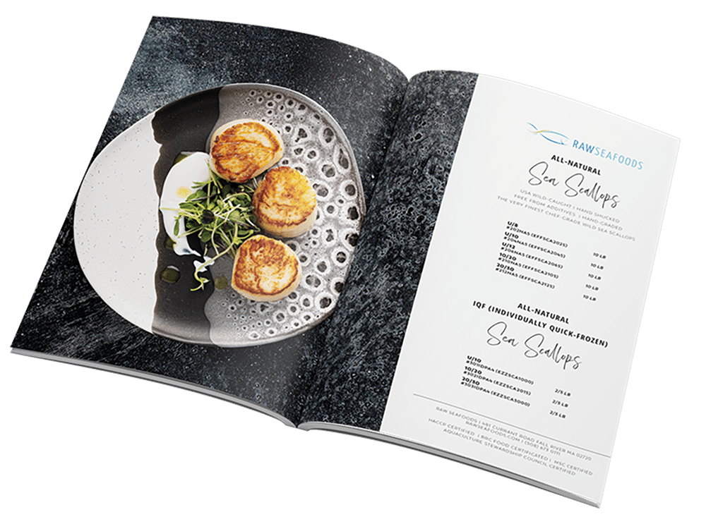 All-natural sea scallops plated on a stylish dish, featured in a product catalog showcasing seafood offerings from Raw Seafoods, highlighting premium quality and culinary presentation.
